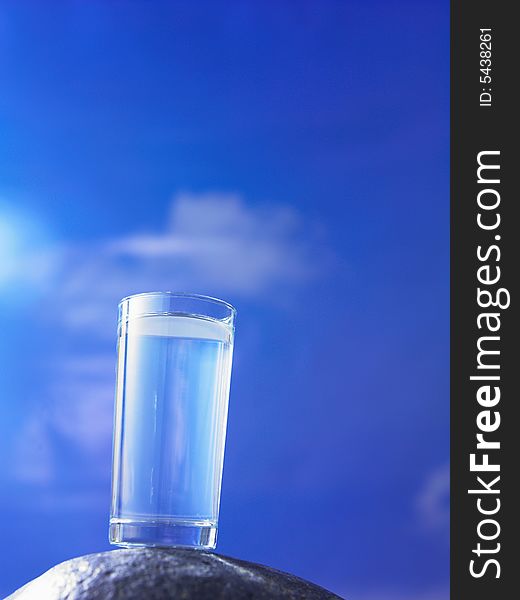 A glass of water with blue sky