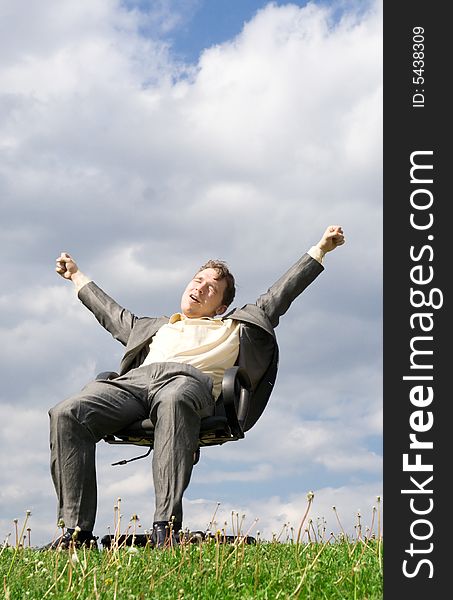 The young businessman sitting on a chair. The young businessman sitting on a chair