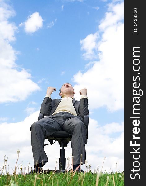 The young businessman sitting on a chair. The young businessman sitting on a chair