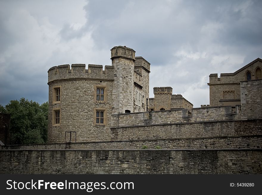 Detail of the tower of London with a cloudy sky background