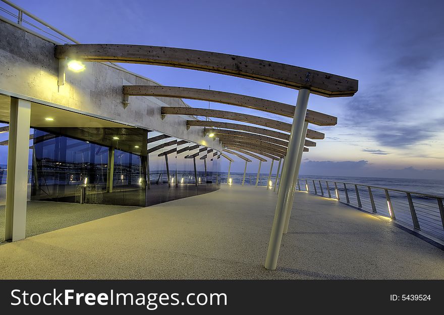 Modern building at the end of a brand new pier photograhed at dusk in tuscany, Italy. Modern building at the end of a brand new pier photograhed at dusk in tuscany, Italy