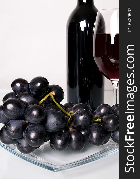 Glass of red wine and grapes. Glass of red wine and grapes.