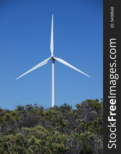 A shot of a single windmill that is part of a huge wind farm generating environmentally friendly electricity. A shot of a single windmill that is part of a huge wind farm generating environmentally friendly electricity