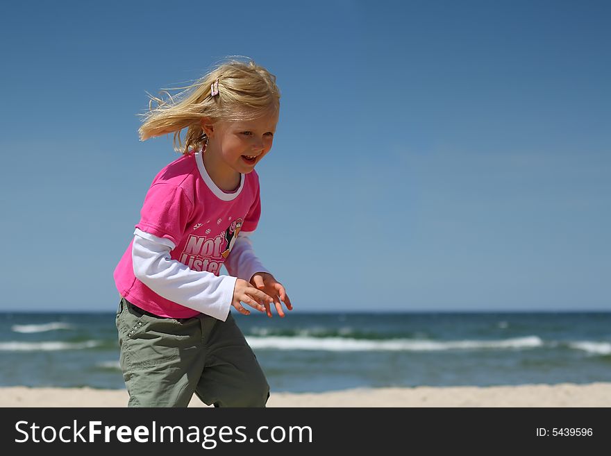 Happy Girl On The Beach