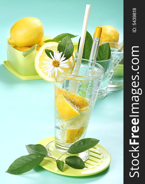 Closeup of glass of iced cold soda with lemon. Closeup of glass of iced cold soda with lemon