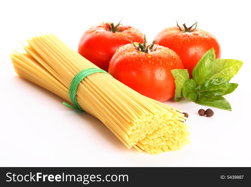 Spaghetti pasta with fresh tomatoes and with basil. Spaghetti pasta with fresh tomatoes and with basil