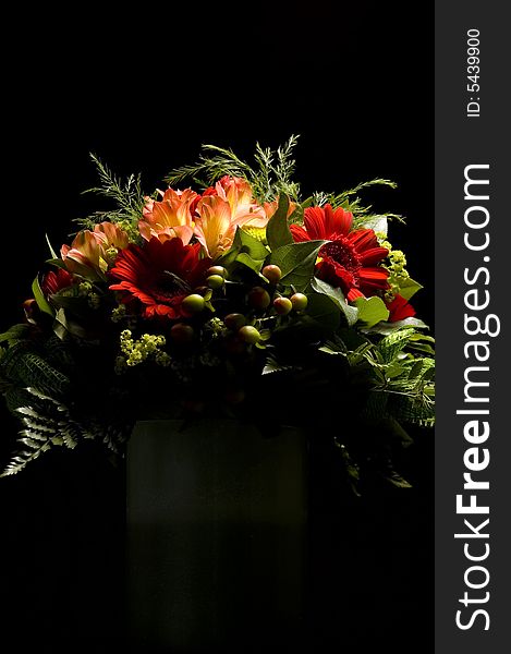 Red flowers bouquet isolated on black with selective lighting