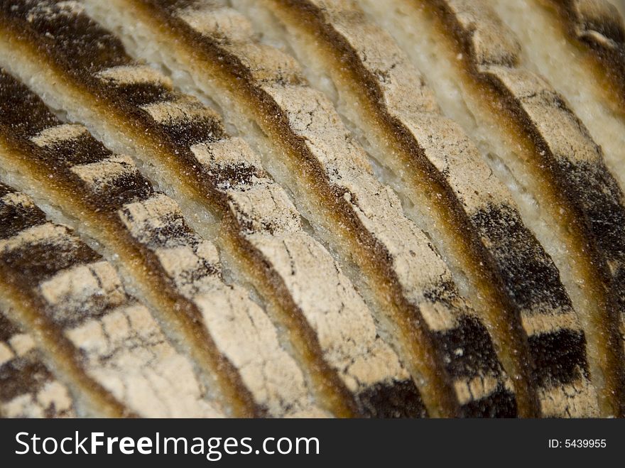 Appetizing fresh bread's slices with brown crust