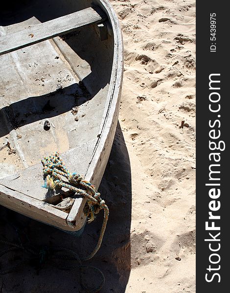 Old row boat on a beach.