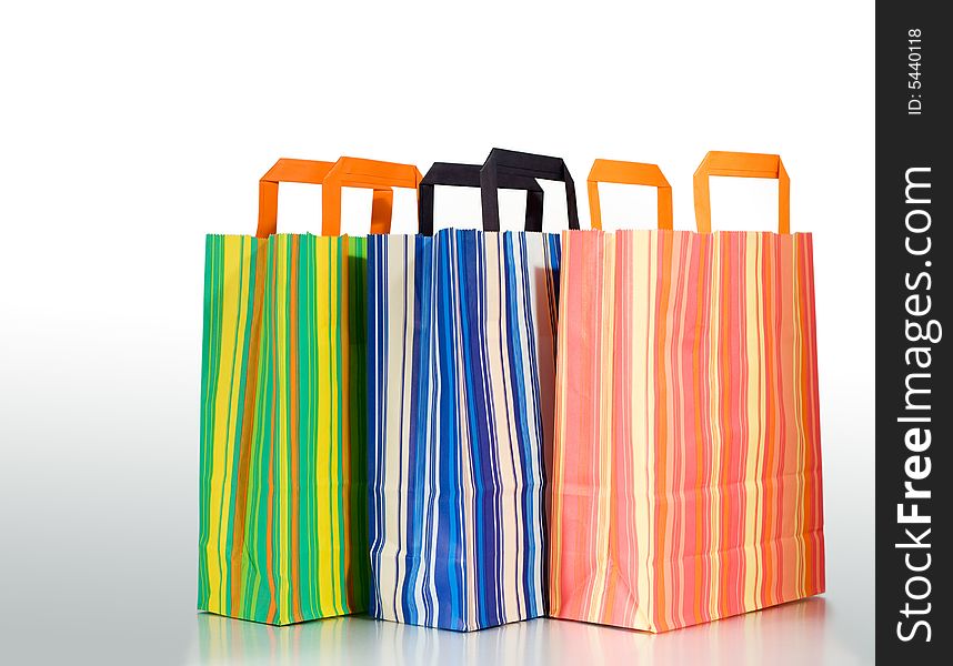 Three shopping bags on white background