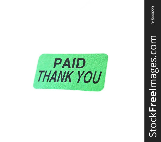 A green sticker with the words Paid Thank You. A green sticker with the words Paid Thank You