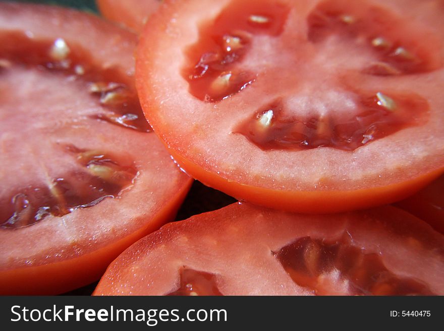 A close up view of slices of roma tomatoes