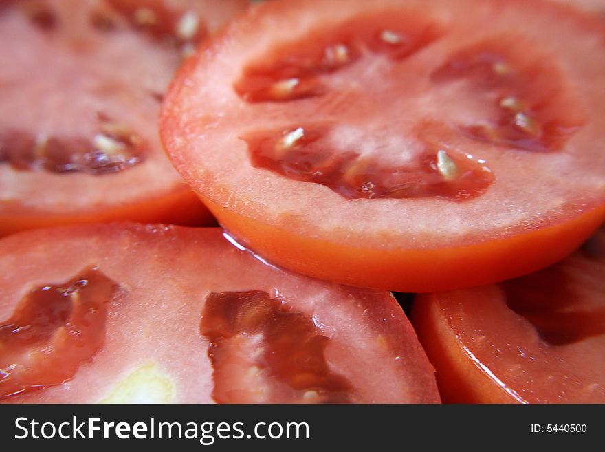 A close up view of slices of roma tomatoes