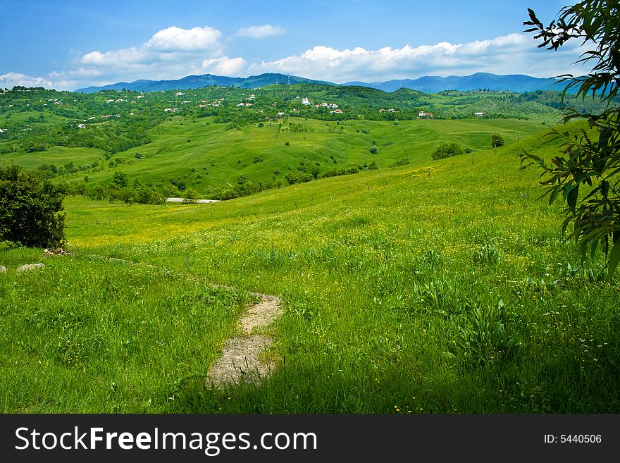 Green fresh hills and blue cloudy sky. Green fresh hills and blue cloudy sky