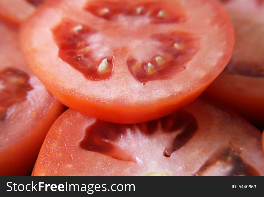 A close up view of slices of roma tomatoes