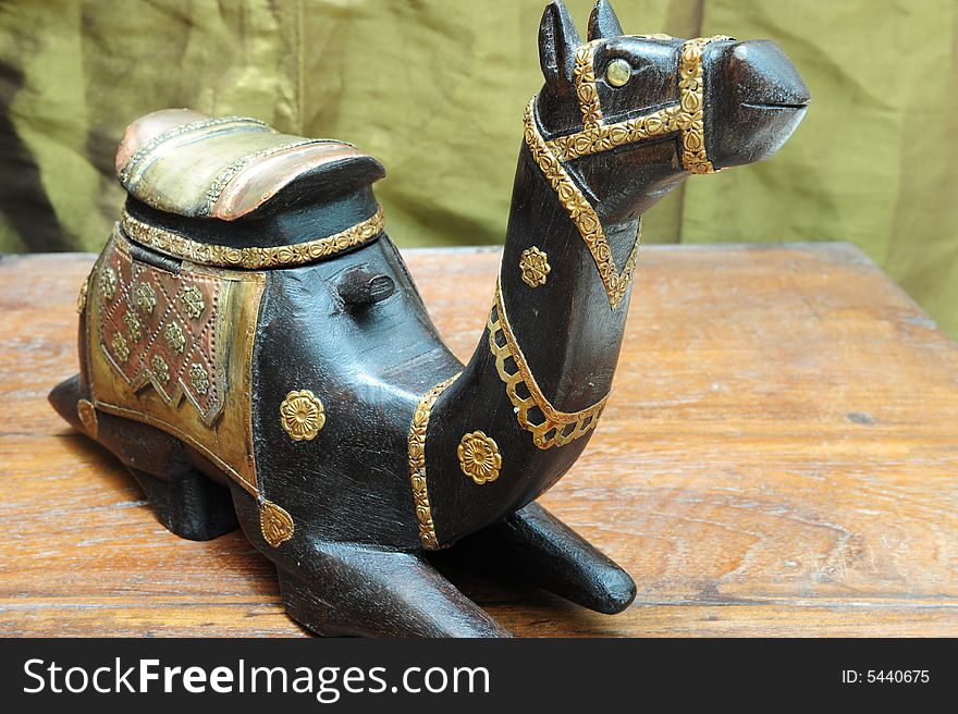 Antique ornamental wood and copper camel with nice detail. Antique ornamental wood and copper camel with nice detail.