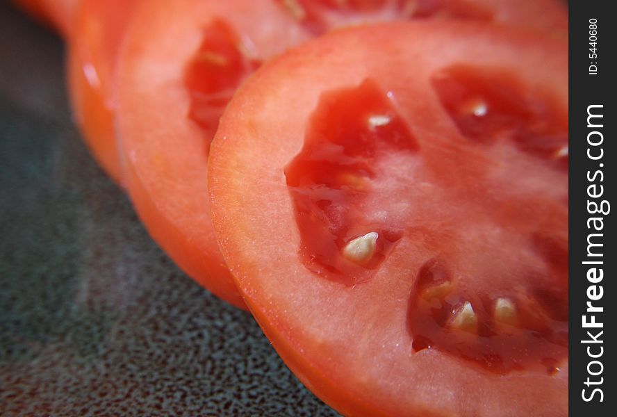 A close up view of slices of roma tomatoes