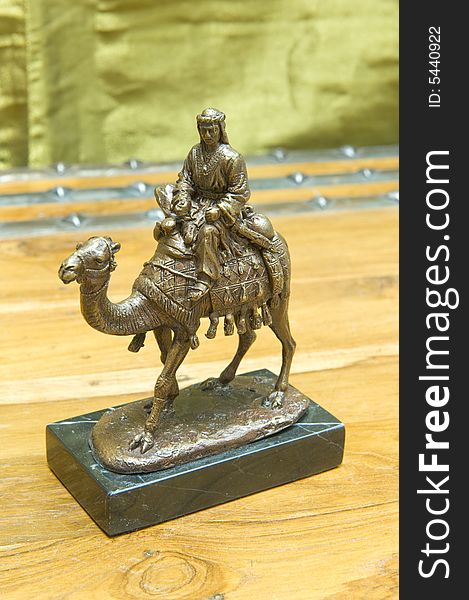 Copper ornament of a man on a camel, possibly one of the three wise men from Biblical times, mounted on solid green marble. Copper ornament of a man on a camel, possibly one of the three wise men from Biblical times, mounted on solid green marble.