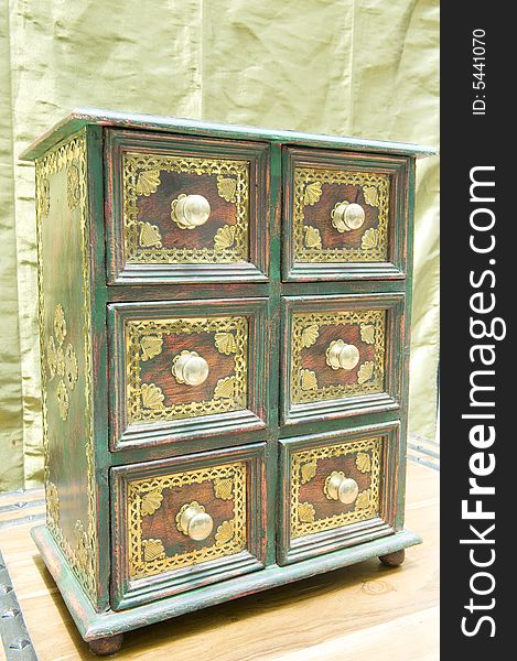 Beautifully restored antique drawer set made of wood with copper insets and knobs. Beautifully restored antique drawer set made of wood with copper insets and knobs.