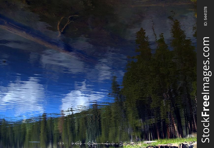 Diffuse reflection of the forest in the surface of a Rocky Mountain lake. Diffuse reflection of the forest in the surface of a Rocky Mountain lake.