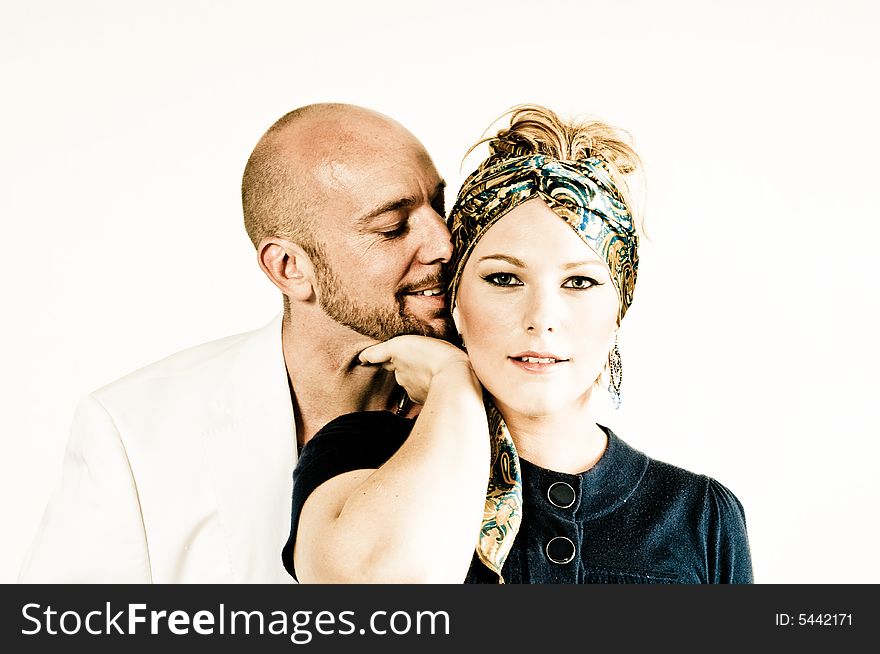 A young couple, photographed in the studio.