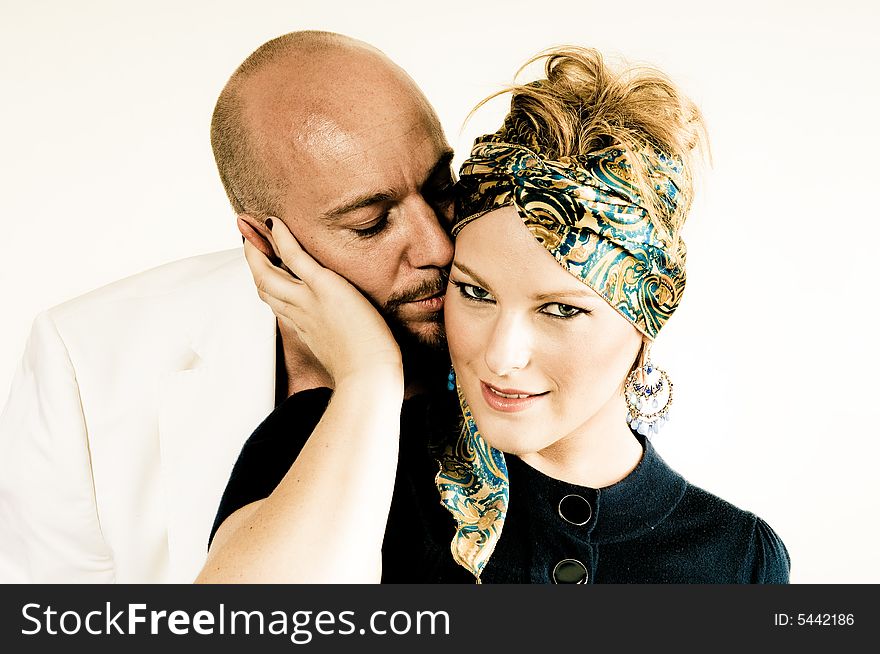 A young couple, photographed in the studio.