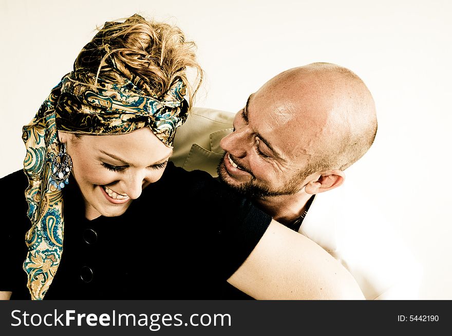 A young couple, photographed in the studio.