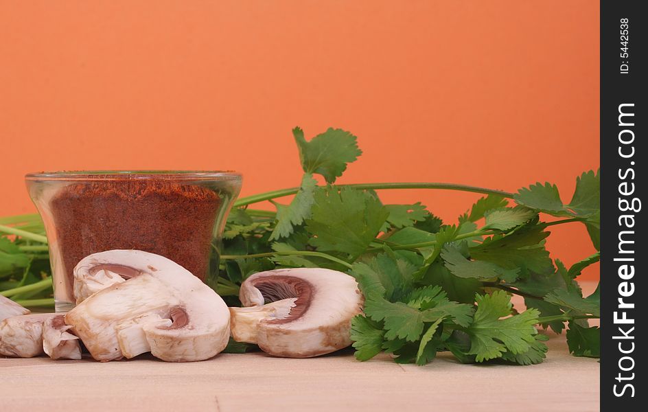 Mushrooms and Paprika With cilantro on Table with Pink Background