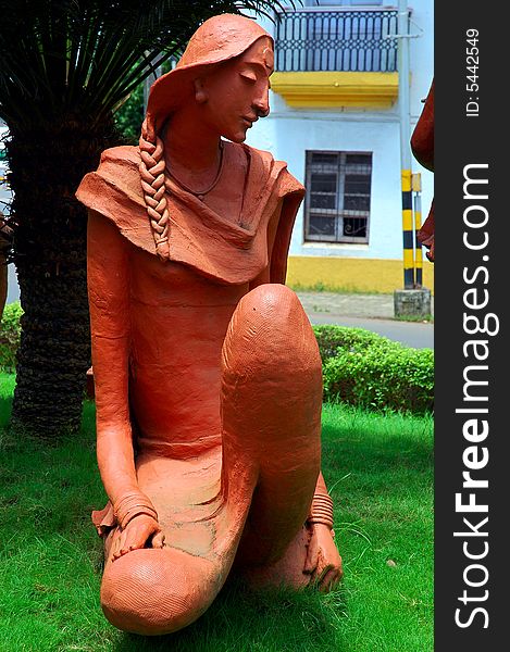 The sculpture of a young woman on road side of Goa town. The sculpture of a young woman on road side of Goa town.