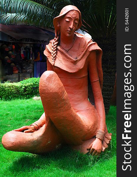 The sculpture of a young woman on road side of Goa town. The sculpture of a young woman on road side of Goa town.