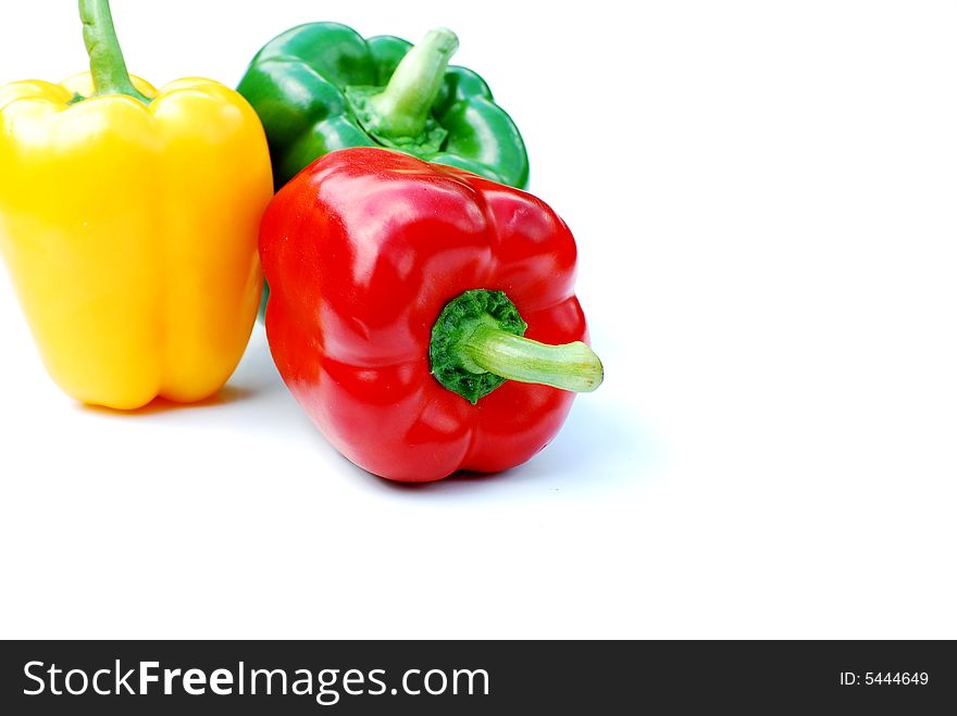 Shot of three different coloured peppers isolated on white. Shot of three different coloured peppers isolated on white