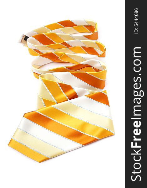 An orange necktie with stripes on white background.