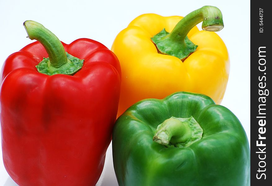 Shot of three different coloured peppers isolated on white. Shot of three different coloured peppers isolated on white