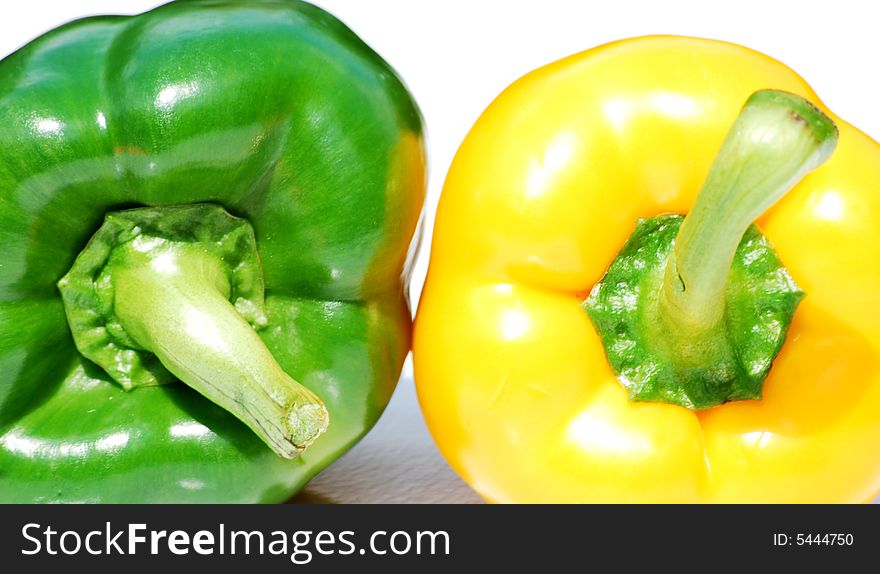 Shot of two different coloured peppers isolated on white. Shot of two different coloured peppers isolated on white