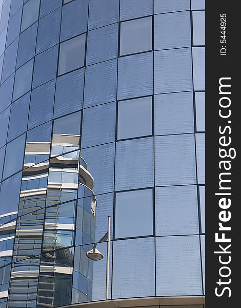 Modern glass blue house with reflected other building in Luxembourg. Modern glass blue house with reflected other building in Luxembourg