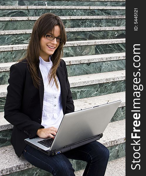 Young businesswoman on stairs