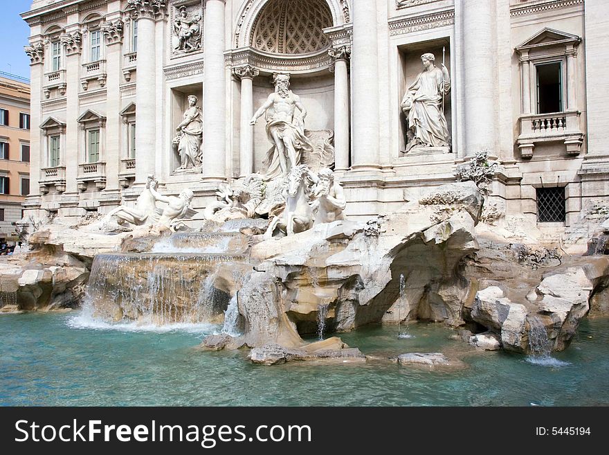 Trevi Fountain, Rome, Italy, with a blue sky background