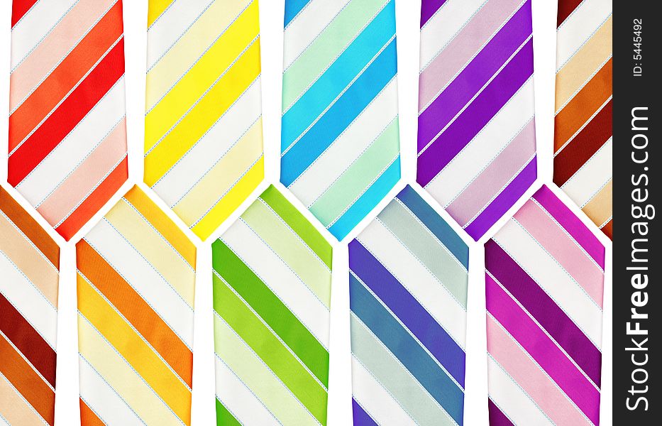 Colorful neckties arranged as background pattern.