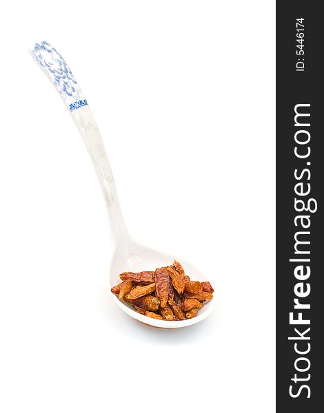 Oriental spices on chinese spon over white background