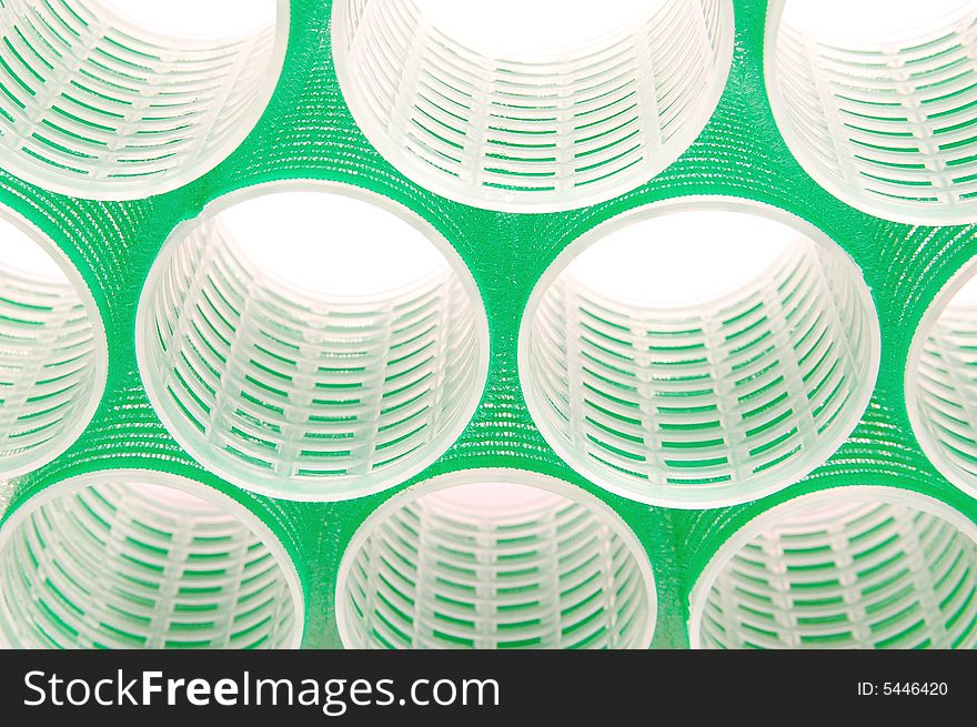 Green hair curlers - abstract background