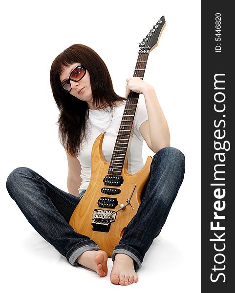 Pretty young girl sitting and holding an electric guitar. Pretty young girl sitting and holding an electric guitar