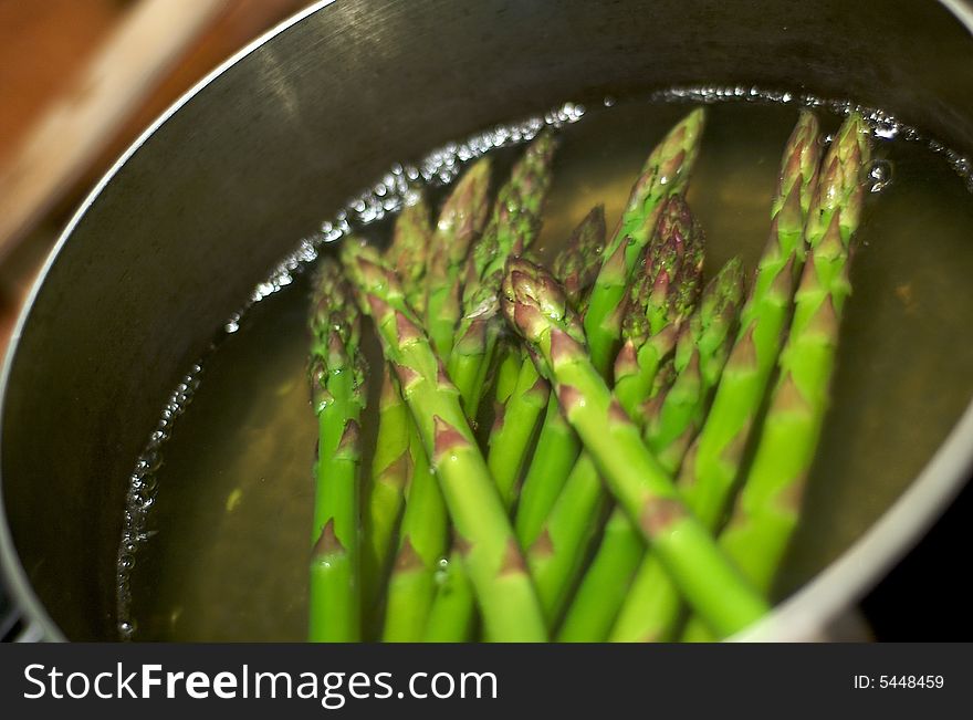 Asparagus boiling in a metal pot