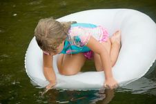 Girl In A Tube On The Water Stock Images Girl In A Tube On The Water Stock Images