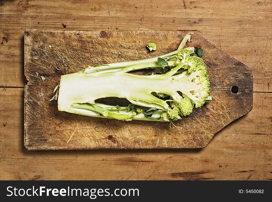 Cut brocoli on old cutting wooden table. Cut brocoli on old cutting wooden table.