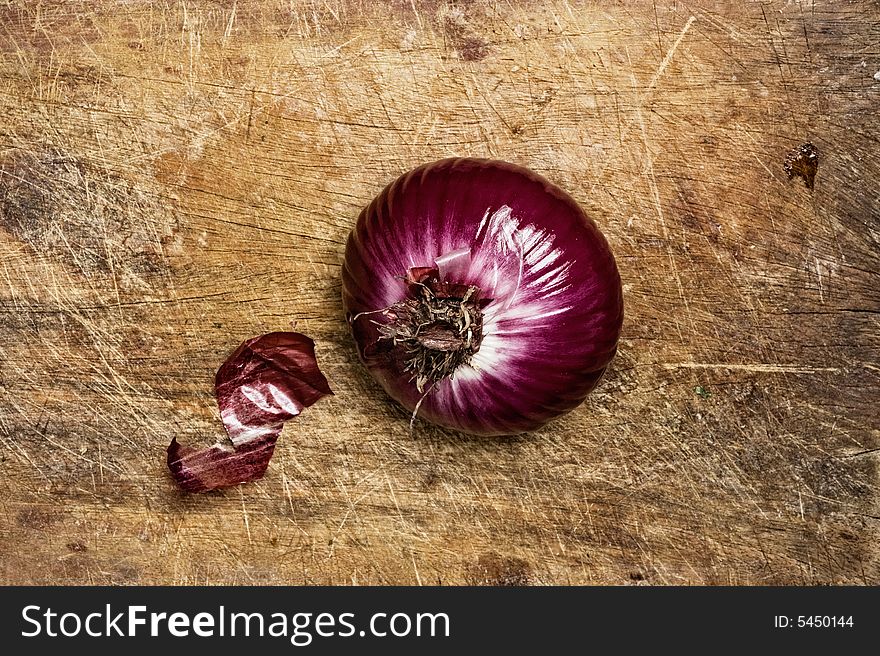 Spanish red onion on wood background