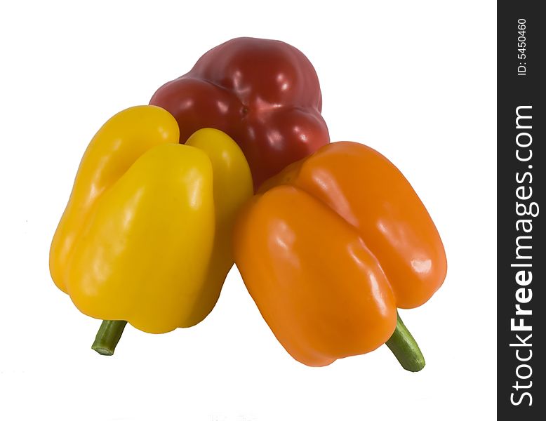 Sweet Bulgarian  peppers of three colors - yellow red and orange. Sweet Bulgarian  peppers of three colors - yellow red and orange