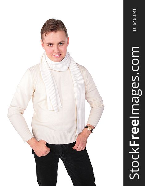 Young man in white sweater poses