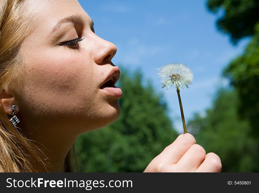 Girl and dandelion