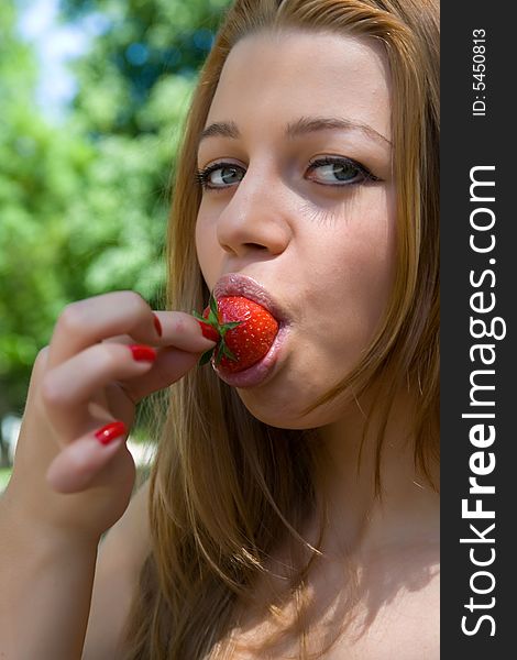 Portrait Of The Beautiful Young Girl With Strawber
