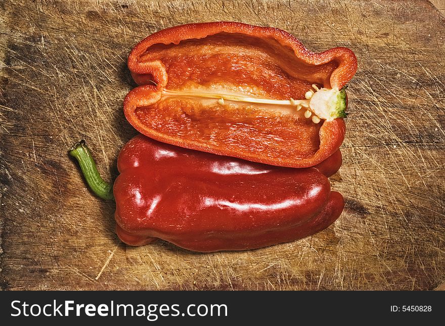 Red pepper on old  cutting table. Red pepper on old  cutting table.